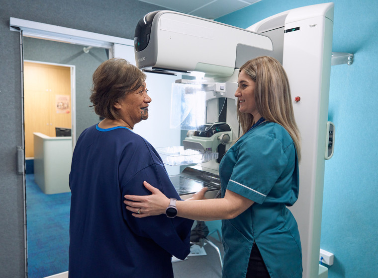 Breast Screen Aotearoa Mammographer conducting a screening on a patient